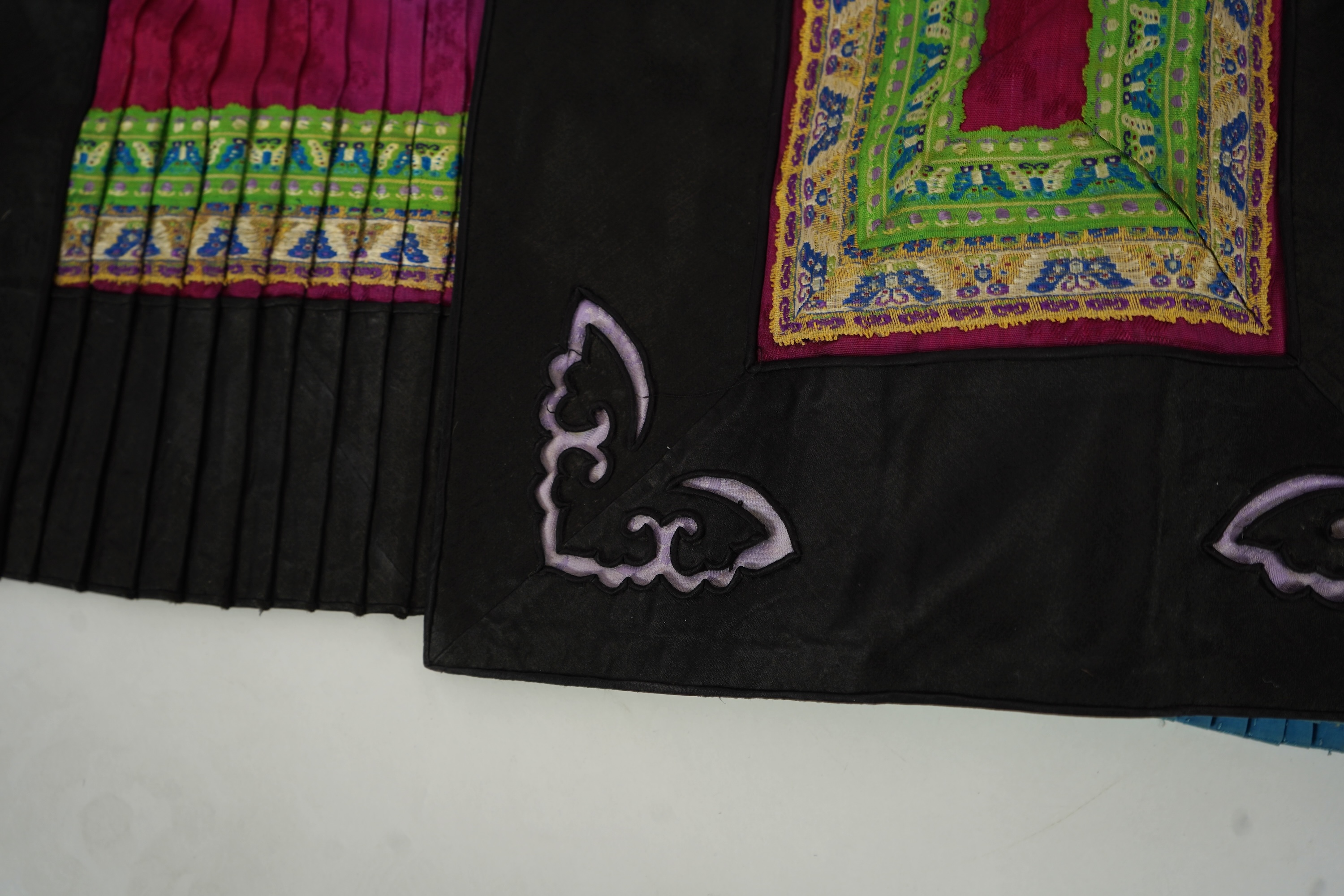Two Chinese embroidered silk wedding skirts, late Qing, five hats, trousers, two skirt panels and two others, collar and a panel